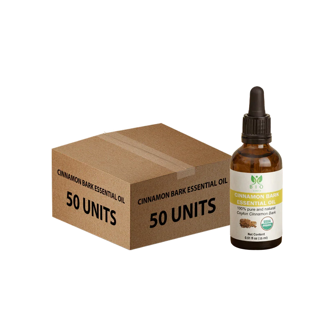 Brown cardboard box labeled Cinnamon Bark Essential Oil 50 units with a 15ml amber dropper bottle of organic cinnamon bark oil