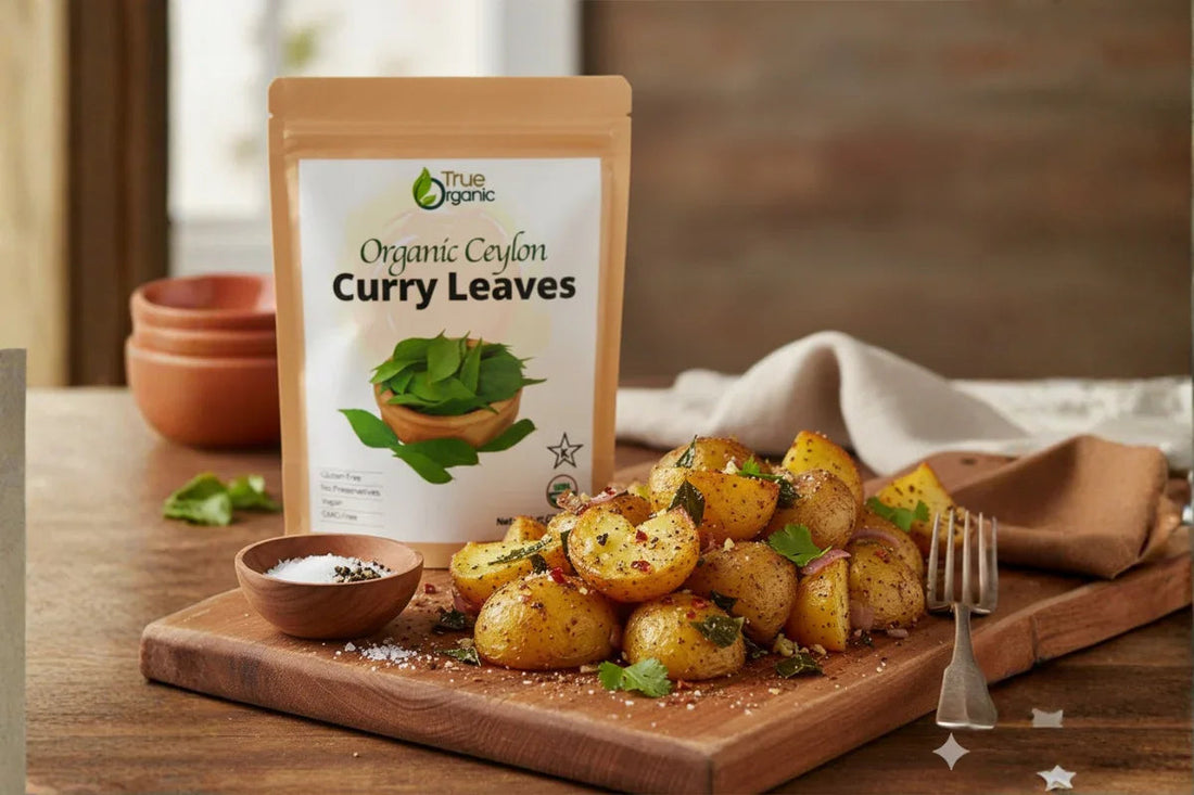 Organic Ceylon curry leaves packaging with spiced roasted baby potatoes on wooden cutting board