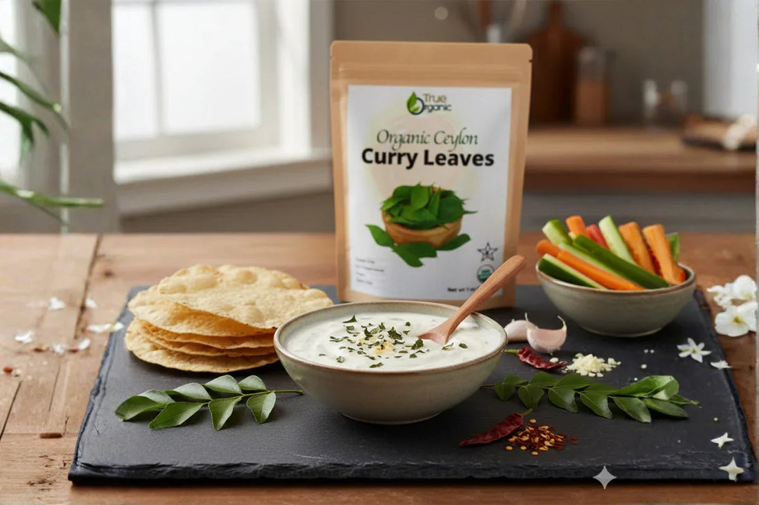 Organic Ceylon curry leaves packet with bowl of yogurt dip, papadums, vegetable sticks on kitchen table