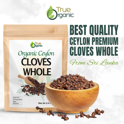 Organic Ceylon whole cloves in wooden bowl with True Organic packaging and text from Sri Lanka